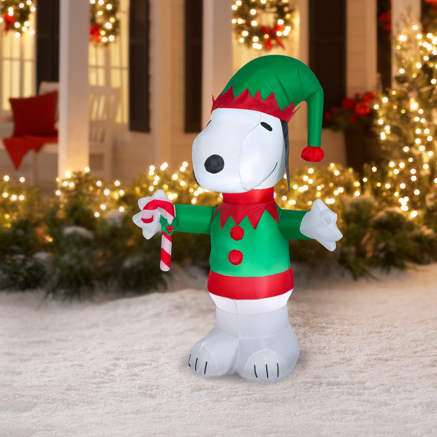Inflatable 5' Snoopy Elf with Candy Cane lifestyle