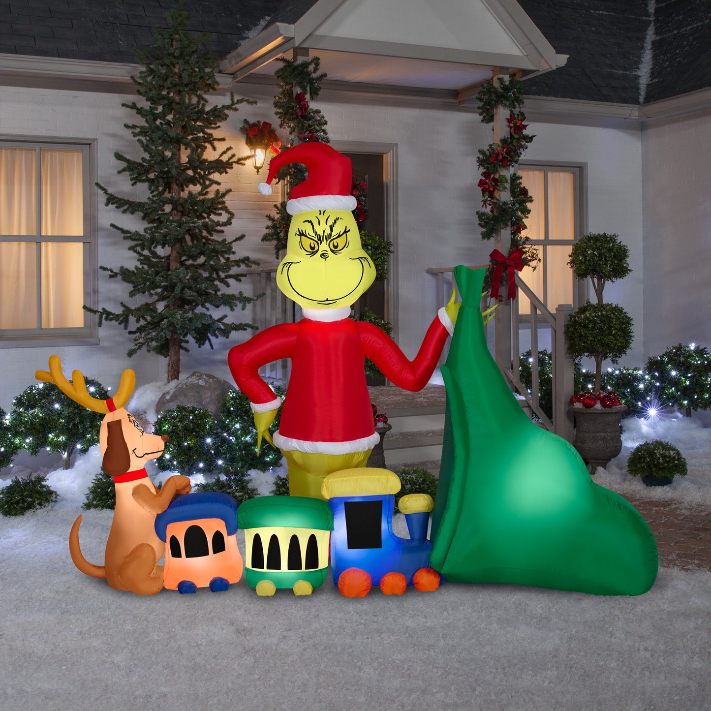 6.5-Ft Grinch Putting Train in Santa Sack Scene Christmas Inflatable lifestyle