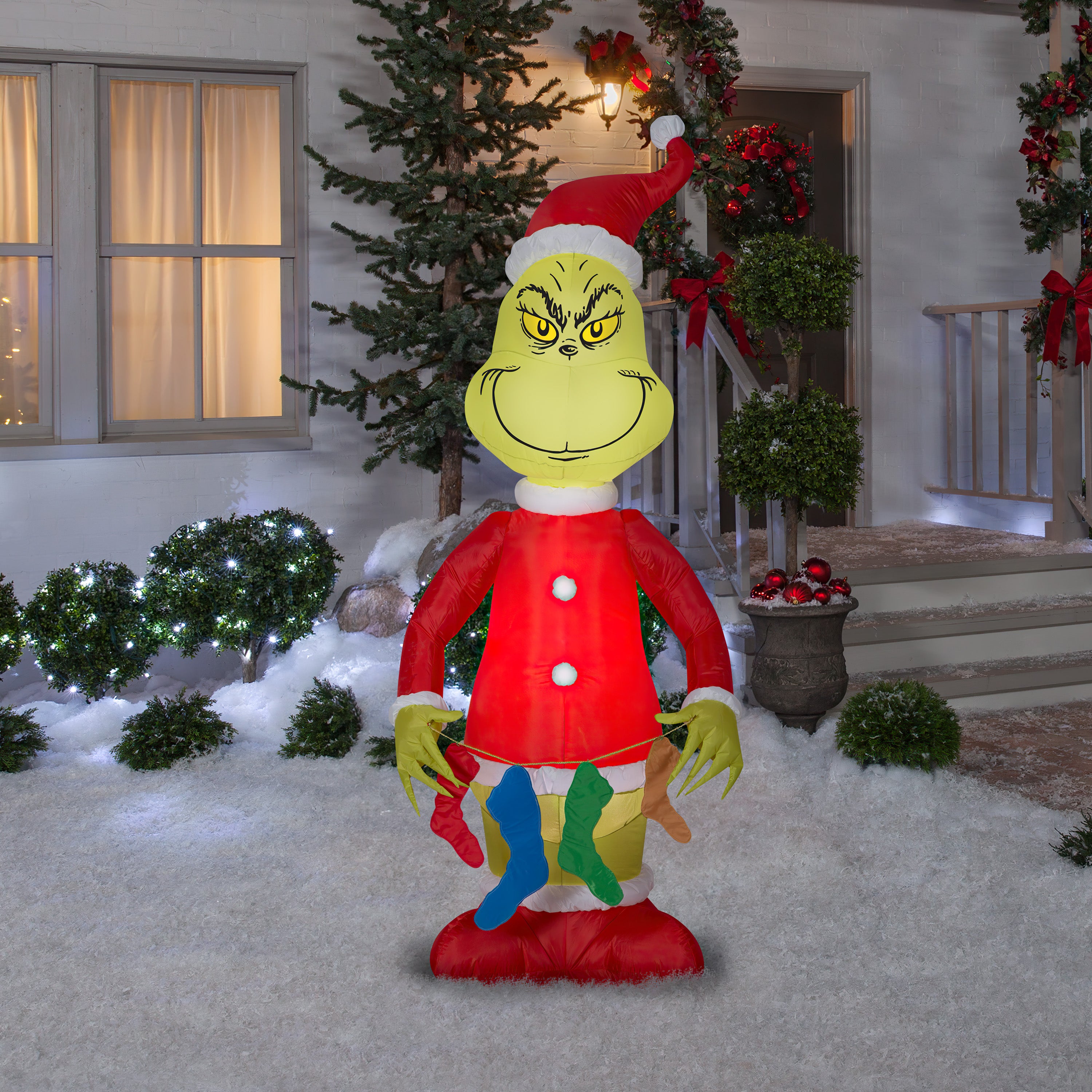Gemmy Christmas Airblown Inflatable Grinch Holding String of Stockings, 6.5 ft Tall, Red