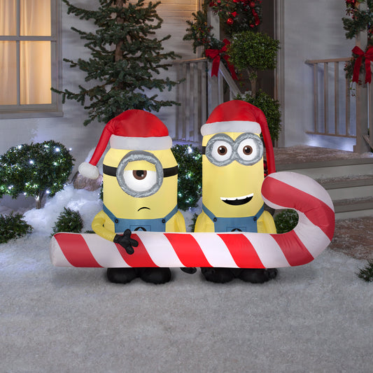 6' Inflatbale Minions Carrying Candy Cane Scene lifestyle