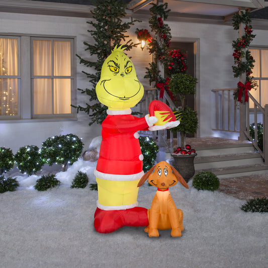 Animated Inflatable Grinch Putting Santa Hat on Max Scene Dr. Seuss, 6 ft Tall lifestyle