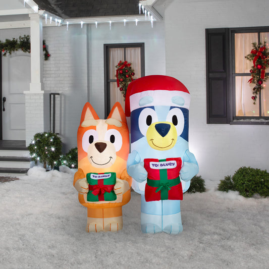 Bluey and Bingo Christmas inflatable in an outdoor holiday display