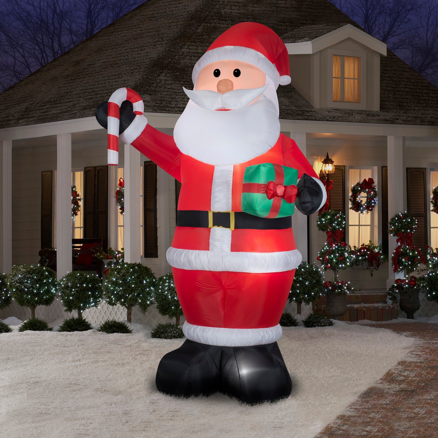 12' Santa w/ Gift and Candy Cane Christmas Inflatable lifestyle