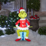 Load image into Gallery viewer, Gemmy Dr. Seuss The Grinch Sitting On Present Tinsel Yard Sculpture, 27-Inch, Pre-Lit LED Christmas Decor
