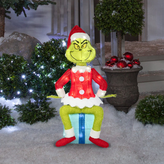 The Grinch Sitting On Present Tinsel Yard Sculpture, 27-Inch, Pre-Lit LED Christmas Décor lifestyle