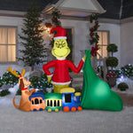 Load image into Gallery viewer, Gemmy Christmas Airblown Inflatable Grinch Putting Train in Santa Sack Scene Dr. Seuss, 6.5 ft Tall

