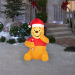 Load image into Gallery viewer, Gemmy Airblown Disney Winnie the Pooh in Santa Hat with Candy Cane Christmas Inflatable, 3.5-Ft, LED Yard Decor
